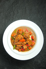 Rustic Braised Goose Stew with Potatoes and Vegetables in Farmhouse Style Bowl