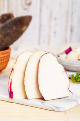 Fresh Sliced Purple Skinned Potatoes on Wooden Cutting Board Kitchen Food Photography