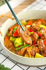 Rustic Duck Goose Casserole Stew with Vegetables in Farmhouse Cast Iron Pot Traditional Country Cooking