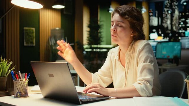 Employee in the office thinking about tactical solution to increase business activity, intuitive perspective and contemplation. Businesswoman solving a dilemma with rational outlook. Camera A.