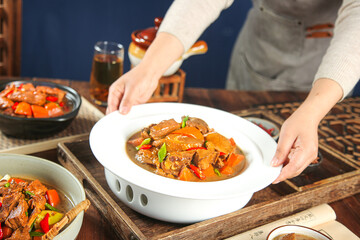 Braised Goose Stew with Potatoes and Vegetables in White Casserole Dish - Traditional Country Cuisine