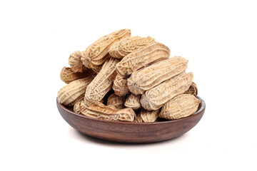 Selenium-enriched Yunnan black peanuts in wooden bowl isolated on white background