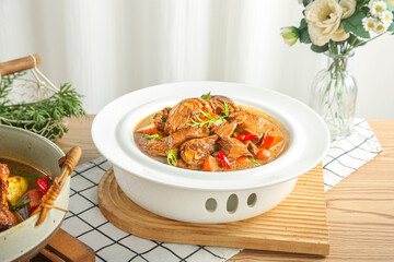 Traditional Goose Casserole with Potatoes in Farmhouse Kitchen Setting