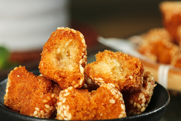 Traditional Crispy Fried Pastry Balls with Sesame Seeds - Golden Brown Specialty Snacks