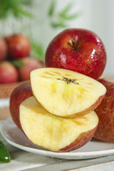 Fresh Daliangshan Yanyuan Apples Sliced on Plate - Healthy Fruit Production Concept