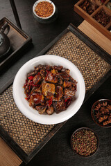 Handrolled Smoked Duck Slabs with Preserved Vegetables and Traditional Spices on Bamboo Serving Tray