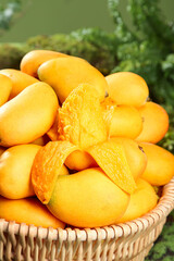 Fresh Small Hainan Mangoes in Basket - Taiwanese Tropical Fruit with Cut Mango Showing Orange Flesh