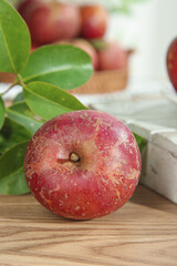 Fresh Red Apple with Rustic Skin on Wooden Table - Healthy Organic Fruit