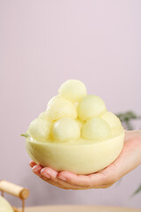 Fresh Peeled Melon Balls in Natural Bowl Held in Hands - Shaanxi Summer Fruit