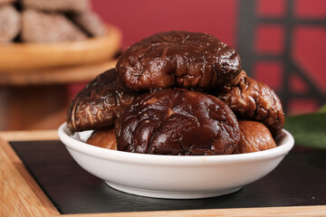 Fresh Shiitake Mushrooms in White Bowl on Wooden Background - Premium Cooking Ingredients