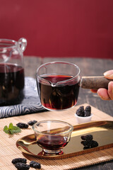 Traditional Xinjiang Black Mulberry Tea with Dried Fruit - Healthy Herbal Drink Closeup