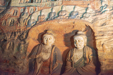 Naklejka premium Giant Buddha statue at the Yungang Grottoes in Datong, Shanxi