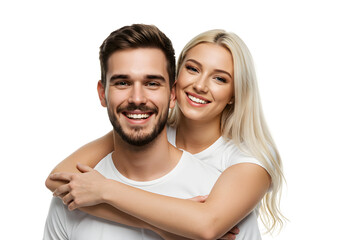 Happy young couple embracing and smiling brightly, captured in a studio portrait on a white background