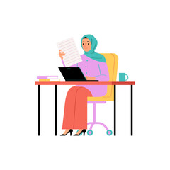 Modern Muslim professional woman in a hijab working on a laptop with documents in a corporate office