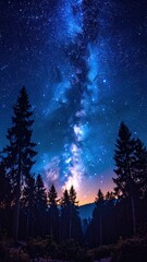 Naklejka premium Stunning view of Milky Way galaxy spanning above silhouetted forest, illuminated by a soft orange glow on the horizon