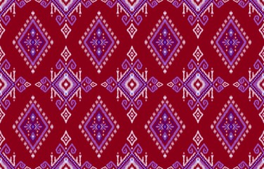 Red and purple geometric ikat seamless tribal ethnic textile pattern