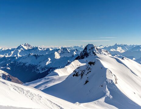 Snow-covered mountain peaks under a bright blue sky. A panoramic view of jagged, white slopes under clear, cloudless day. Crisp, clean feel