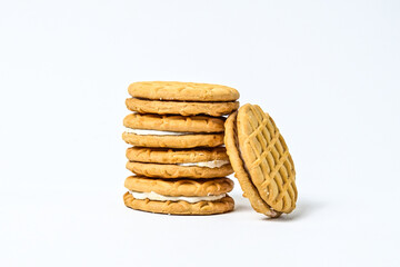 Side view of five biscuits isolated on white background. clipping path. pile, stack. milk biscuits with jam and cream. close up.