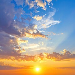 A vibrant sunset fills the sky with golden light. Clouds drift across a gradient of blues and oranges, creating a serene atmosphere