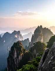 Breathtaking mountain peaks covered in greenery rise above a misty landscape, bathed in the soft light of a colorful dawn or sunset sky