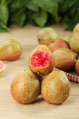 Fresh Guava Fruits with Red Pink Flesh on Wood Surface - Tropical Fujian Produce