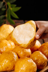 Fresh Cut Pears Showing Juicy White Flesh - Hand Holding Ripe Fruit Varieties
