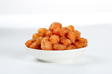 Dried Yunnan Golden Berry Physalis Fruit in White Bowl on White Background