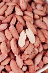 Red-skinned peanuts with white kernels - farm-grown legumes for healthy snacking and cooking
