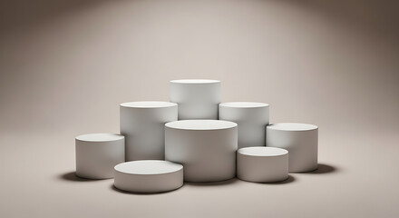 A collection of various sized white cylindrical podiums and platforms arranged in a cluster on a neutral beige background