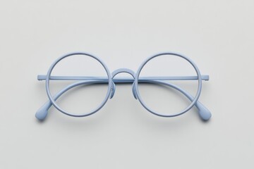 Light blue round glasses on a pale surface. A centered close-up features thin, round eyewear with a minimalist, airy aesthetic