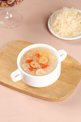 Creamy Mushroom Shrimp Soup with Vegetables in White Bowl on Wooden Cutting Board