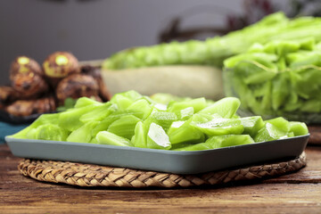 Fresh Sliced Lettuce Display with Farm Vegetables on Rustic Kitchen Table
