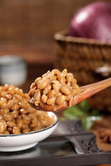 Japanese Natto Fermented Soybeans on Wooden Spoon - Traditional Asian Health Food