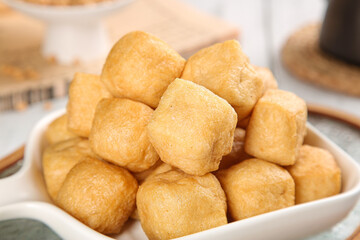 Golden Fried Tofu Puffs in Bowl - Crispy Bean Curd Cubes for Asian Cooking