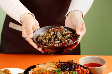 Spicy Stir-Fried Whelk Snails in Traditional Bowl - Asian Seafood Cuisine