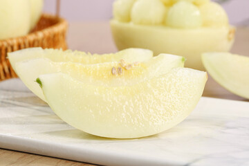Fresh Sliced Honeydew Melon Wedges on White Plate - Healthy Organic Fruit Snack