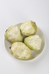 Fresh Guangxi Guava Slices on White Plate Showing Heart-Shaped Cross Section