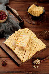 Sliced Fresh Tofu on Wooden Board with Asian Cooking Ingredients and Spices