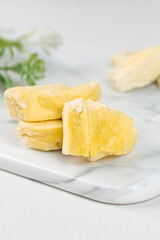 Dried Durian Fruit Slices on Marble Board - Golden Specialty Asian Snack Food Products