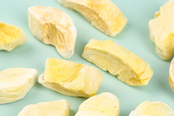 Dried Durian Fruit Slices - Golden Asian Specialty Food Product on Pastel Background