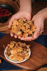 Authentic Dried Gourmet Mushrooms from Northeast China in Cupped Hands Traditional Asian Food Photography
