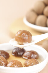 Guangdong Glutinous Rice Dumplings with Cinnamon on White Display Spoons