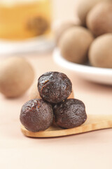 Guangdong Dried Cinnamon Dumplings on Wooden Spoon White Background Chinese Food Photography