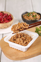 Japanese Natto Fermented Soybeans with Chopsticks - Traditional Healthy Asian Food