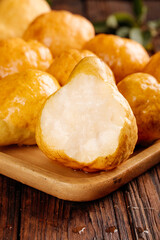 Fresh Chinese Yantai Pears on Wooden Board - Golden Asian Fruit with White Flesh