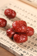 Sweet Hotan Jujubes from Xinjiang China on Traditional Text Background