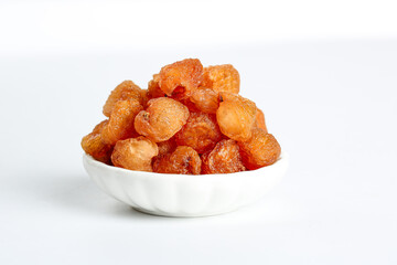 Dried Longan Fruit from Yunnan China in White Bowl on Clean Background