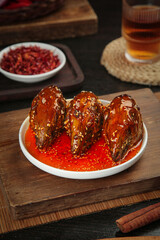Spicy Braised Rabbit Head Dish with Chili Sauce Chinese Cuisine Traditional Asian Food Presentation