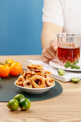 Spicy Fried Squid Rings with Lime and Tea - Delicious Seafood Snack Appetizer