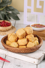 Deep Fried Tofu Cubes in Wicker Basket - Asian Vegetarian Food on Rustic White Wood Background